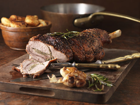 Christmas dinner. Roasted rosemary and garlic leg of lamb and roast potatoes