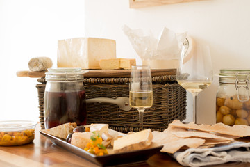 Glasses of Wine With Servings of Cheese and Biscuits