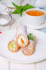 Homemade cannoli stuffed with ricotta cheese cream