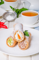 Homemade cannoli stuffed with ricotta cheese cream
