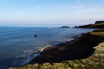 Cornish coastline viewed from the cliff in Bude