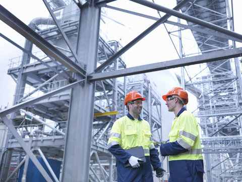 Workers Talking At Biomass Factory