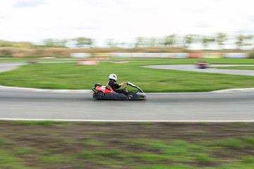 Super kart racing team. The racer on carting. 