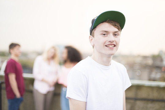 Teenage boy wearing baseball cap