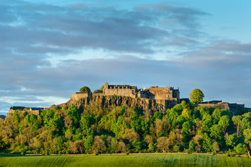 Stirling Castle in setting sunlight.