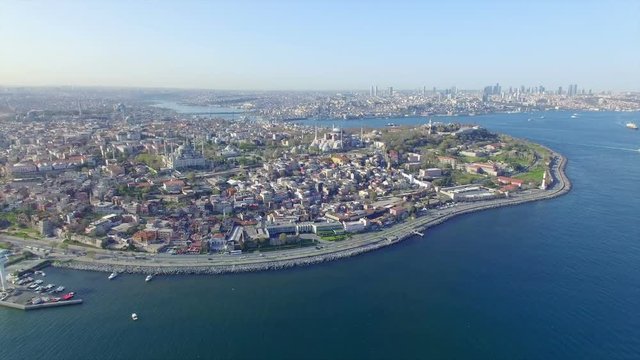 Aerial view from drone of seafront and famous landmarks - Blue Mosque and Hagia Sophia in Istanbul, Turkey