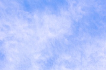 Translucent cloudiness on blue sky background