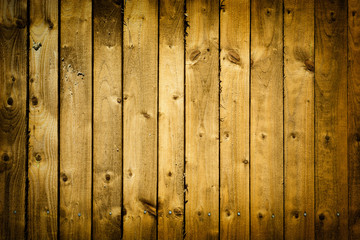 Old wooden planks fence with vignette