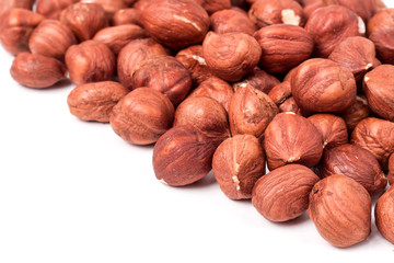 peeled hazelnuts isolated on white background macro