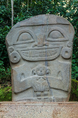Fototapeta na wymiar Ancient statue in archeological park in San Agustin, Colombia