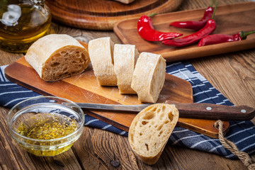 Sliced ciabatta bread on cutting board.