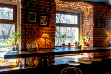interior cafe - wooden table and chairs by window