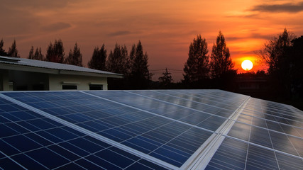Solar panel with sunrise, rooftop