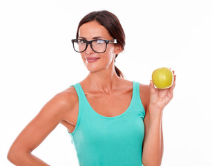 Smiling adult woman holding and apple