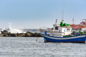 Small fishing boat at an ocean port of Santa Cruz town on Tenerife island