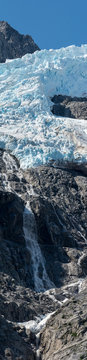 Stream running down cliff under Glacier