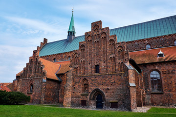 Transept and the church nave with spire and green cobber roof on Elsinore Cathedral