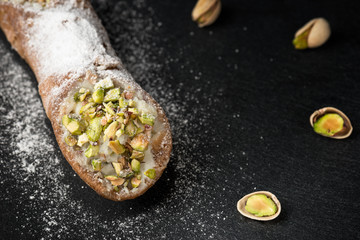 Sicilian cannoli stuffed with ricotta cheese and pistachio, traditional Sicilian dessert, Italian pastry