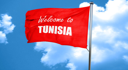 Welcome to tunisia, 3D rendering, a red waving flag