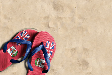 Thongs with flag of Bermuda, on beach sand