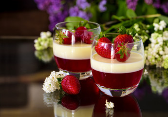 Spring dessert pannacotta with strawberries and flowers
