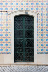 Vintage doorway with traditional Portuguese tiles - Azulejos, Portugal