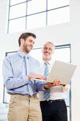 Businessmen working on laptop