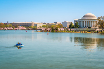 Wide angle travel view of Washington DC boating on Potomac River near Jefferson Memorial