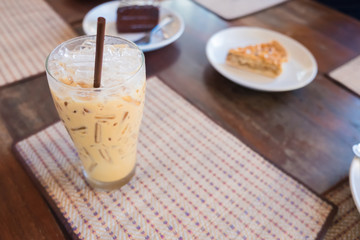 Iced coffee with milk is on the mat