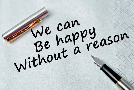 Text We can be happy without a reason on napkin
