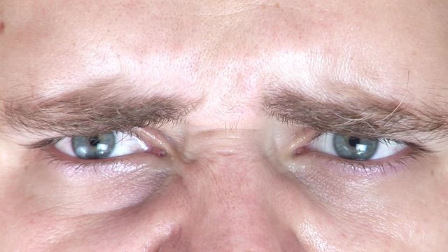 Angry man looking at camera and making angry faces 