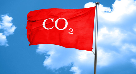 CO2 warning sign, 3D rendering, a red waving flag