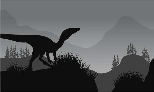 Silhouette of one eoraptor in hills