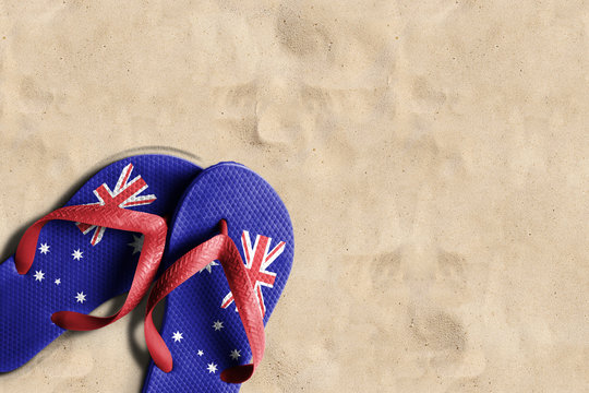 Thongs with flag of Australia, on beach sand