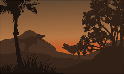 At afternoon tyrannosaurus in hills of silhouette