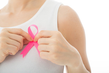 .Pink Breast cancer awareness ribbon holding by woman
