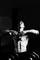 Fototapeta na wymiar Muscular Man Exercise With KettleBell