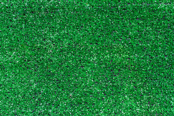 Top view of artificial green grass texture for golf course background.