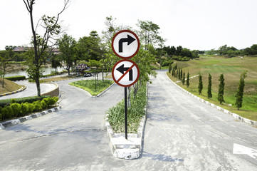 No Left Turn Sign, and can right turn Sign with natural bachgrou