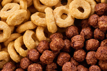 Cereals breakfast. Corn rings and balls macro.