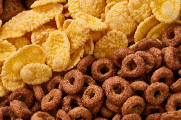 Cereals breakfast. Cornflakes and rings macro.