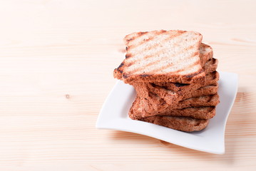fresh toast in a plate on the table