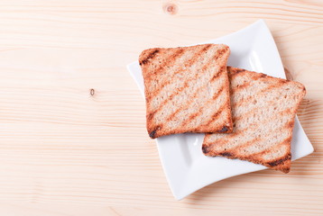 fresh toast in a plate on the table