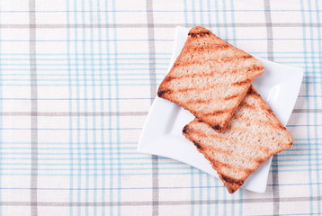 fresh toast in a plate on the table