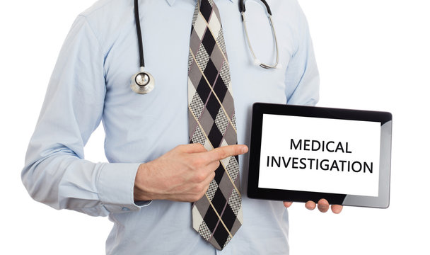 Doctor holding tablet - Medical investigation