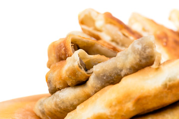 Delicious sliced puff pie with mushrooms.