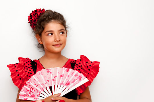 Cute girl with costume holding hand fan