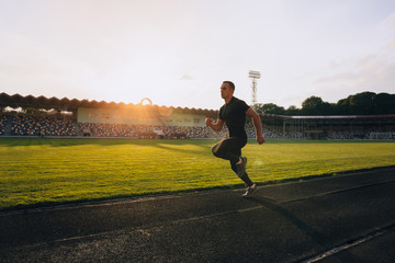 Fototapeta na wymiar Runner on the track at a sport stadium