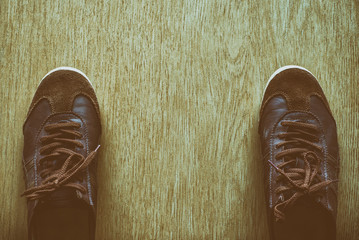 Leather shoes on the wooden floor Vintage color tone