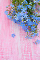 Forgetmenot flowers on wooden surface